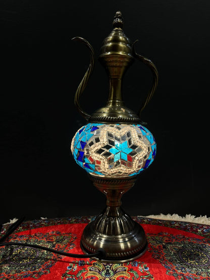 Mosaic Genie Lamp Blue Star Light-Elevate your decor with the enchanting charm of our Turkish Mosaic Genie Lamp. Handcrafted by skilled artisans, this exquisite lamp captures the spirit of the mystical East. Its intricate mosaic glass design creates a mes