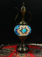 Mosaic Genie Lamp Blue Star Light-Elevate your decor with the enchanting charm of our Turkish Mosaic Genie Lamp. Handcrafted by skilled artisans, this exquisite lamp captures the spirit of the mystical East. Its intricate mosaic glass design creates a mes
