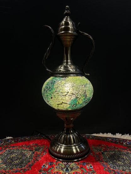 Mosaic Genie Lamp Green Crackle-Elevate your decor with the enchanting charm of our Turkish Mosaic Genie Lamp. Handcrafted by skilled artisans, this exquisite lamp captures the spirit of the mystical East. Its intricate mosaic glass design creates a mesme