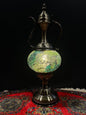 Mosaic Genie Lamp Green Crackle-Elevate your decor with the enchanting charm of our Turkish Mosaic Genie Lamp. Handcrafted by skilled artisans, this exquisite lamp captures the spirit of the mystical East. Its intricate mosaic glass design creates a mesme