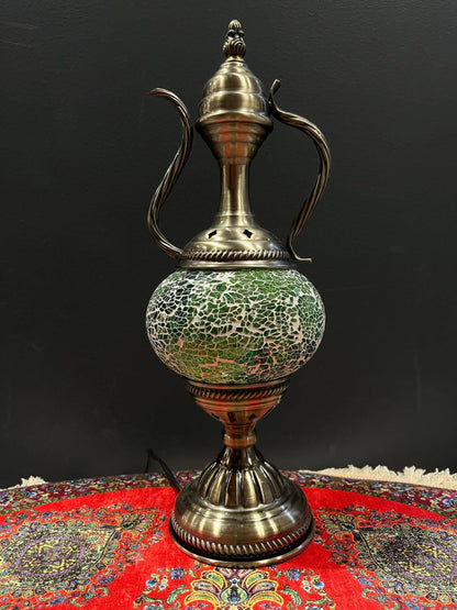 Mosaic Genie Lamp Green Crackle-Elevate your decor with the enchanting charm of our Turkish Mosaic Genie Lamp. Handcrafted by skilled artisans, this exquisite lamp captures the spirit of the mystical East. Its intricate mosaic glass design creates a mesme