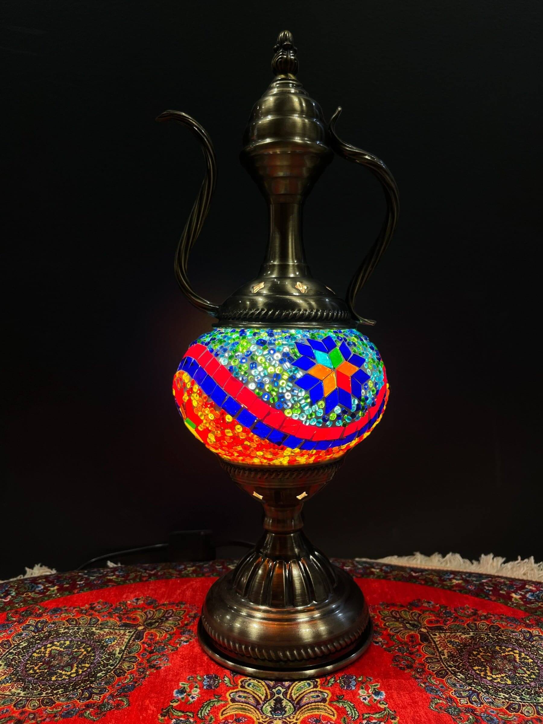 Mosaic Genie Lamp Orange Blue Mix-Elevate your decor with the enchanting charm of our Turkish Mosaic Genie Lamp. Handcrafted by skilled artisans, this exquisite lamp captures the spirit of the mystical East. Its intricate mosaic glass design creates a mes