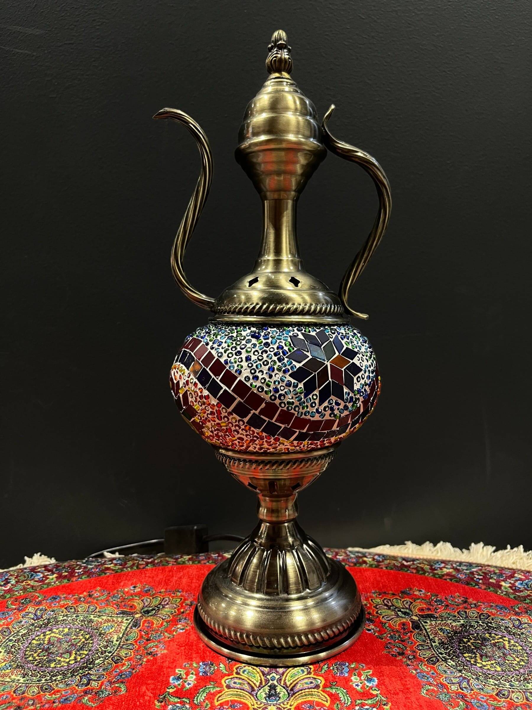 Mosaic Genie Lamp Orange Blue Mix-Elevate your decor with the enchanting charm of our Turkish Mosaic Genie Lamp. Handcrafted by skilled artisans, this exquisite lamp captures the spirit of the mystical East. Its intricate mosaic glass design creates a mes