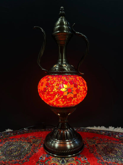 Mosaic Genie Lamp Orange Flower-Elevate your decor with the enchanting charm of our Turkish Mosaic Genie Lamp. Handcrafted by skilled artisans, this exquisite lamp captures the spirit of the mystical East. Its intricate mosaic glass design creates a mesme
