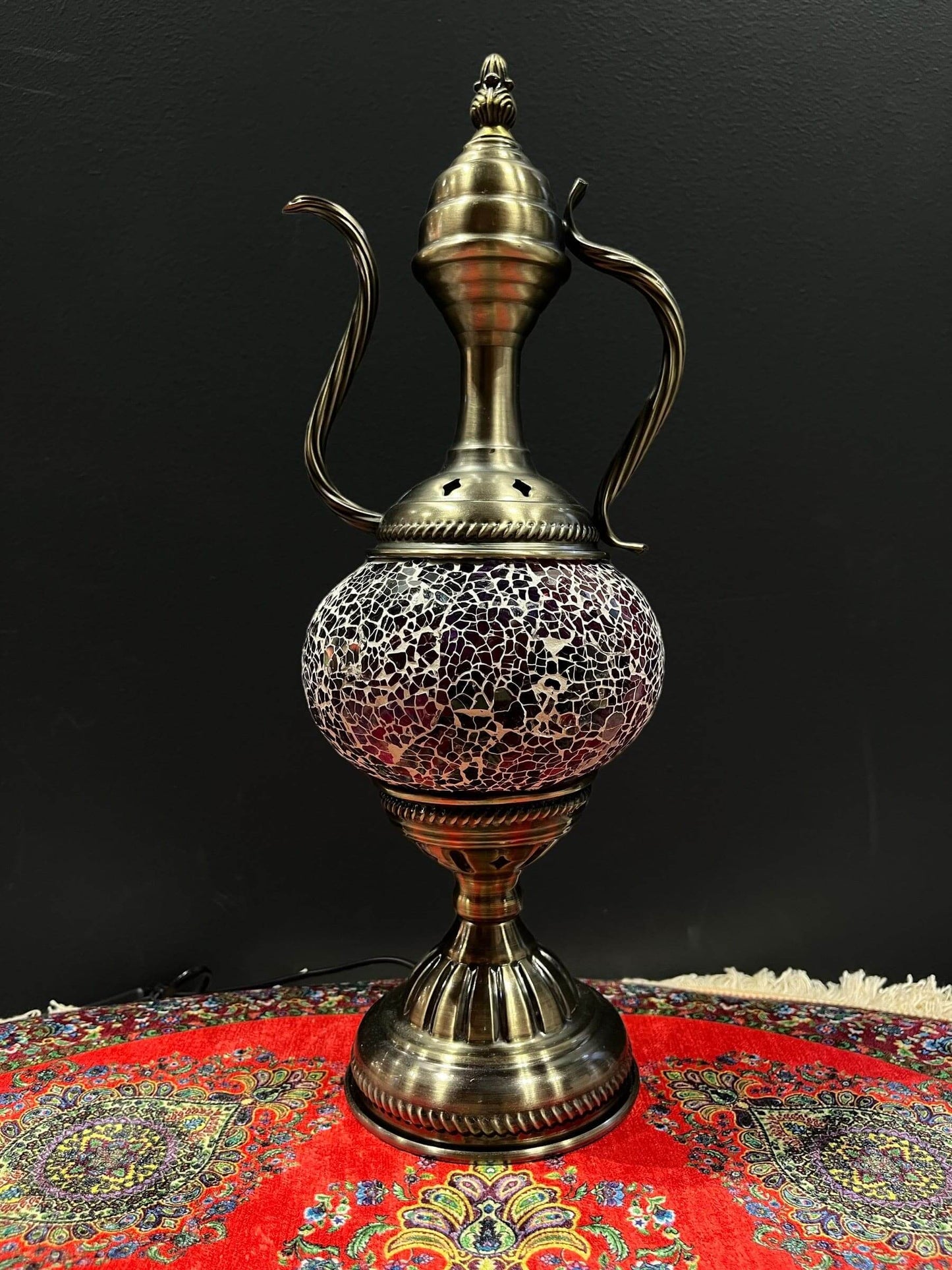 Mosaic Genie Lamp Purple Crackle-Elevate your decor with the enchanting charm of our Turkish Mosaic Genie Lamp. Handcrafted by skilled artisans, this exquisite lamp captures the spirit of the mystical East. Its intricate mosaic glass design creates a mesm