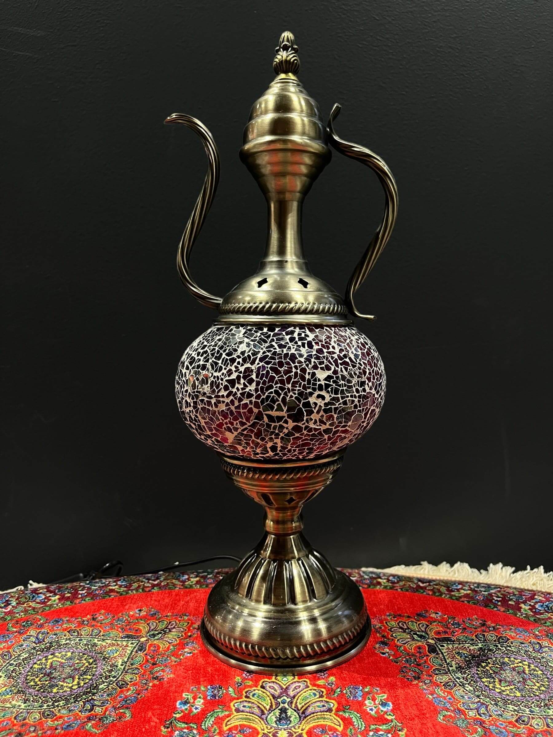 Mosaic Genie Lamp Purple Crackle-Elevate your decor with the enchanting charm of our Turkish Mosaic Genie Lamp. Handcrafted by skilled artisans, this exquisite lamp captures the spirit of the mystical East. Its intricate mosaic glass design creates a mesm