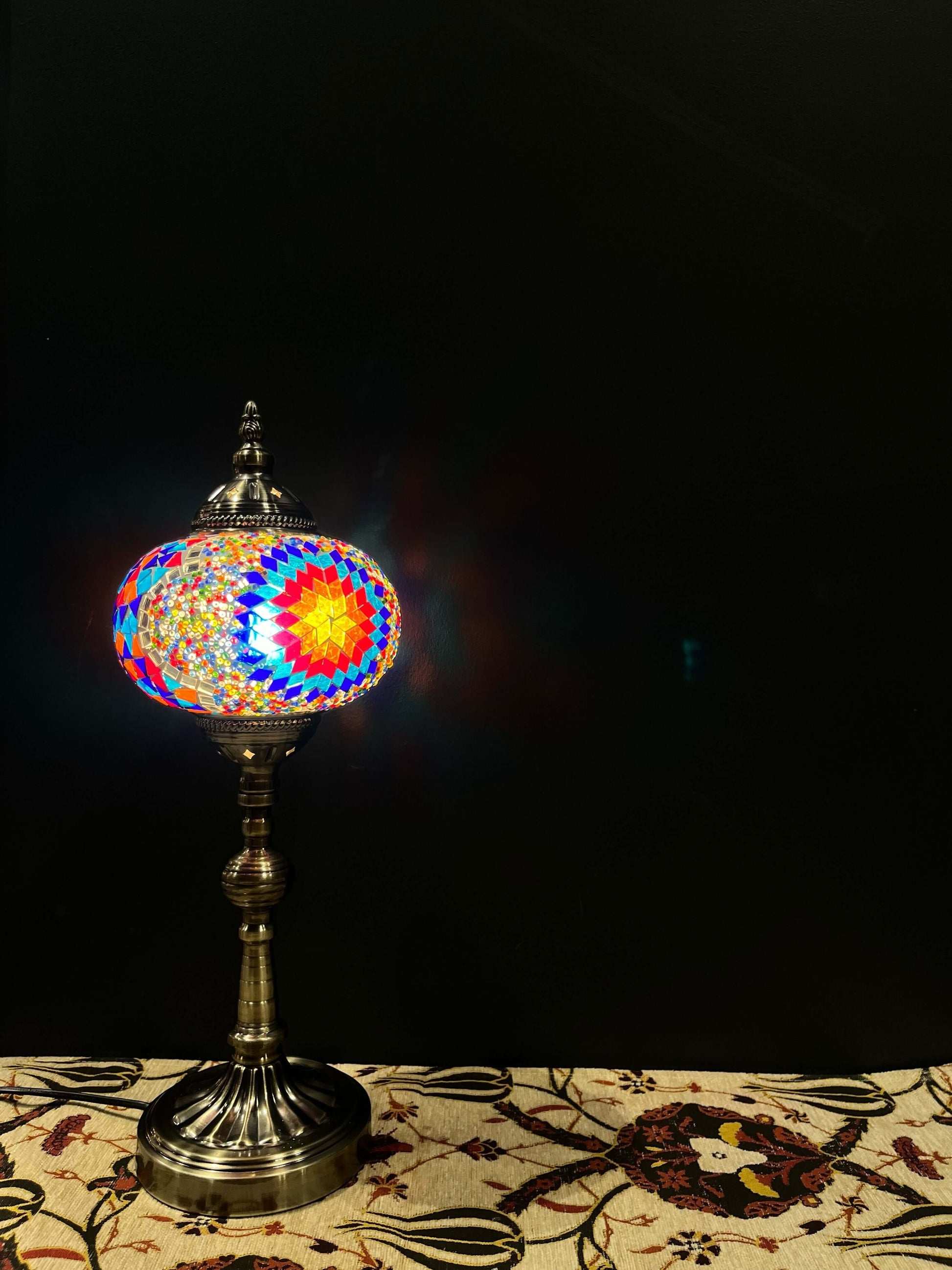 Mosaic Lamp Long Stand 17cm Glass Classic-Brighten your space with our handmade Mosaic Lamp. This vibrant table lamp features a multicolored mosaic pattern that adds elegance and warmth to any room. The intricate mosaic lampshade, crafted by skilled artis