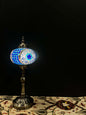 Mosaic Lamp Long Stand 17cm Glass Evil Eye-Brighten your space with our handmade Mosaic Lamp. This vibrant table lamp features a multicolored mosaic pattern that adds elegance and warmth to any room. The intricate mosaic lampshade, crafted by skilled arti
