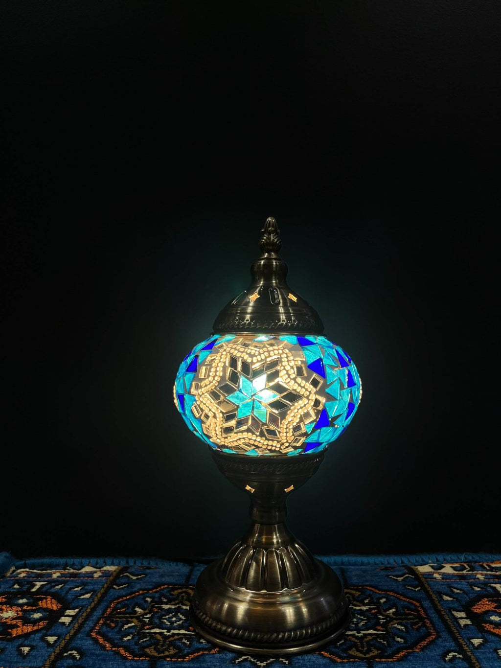 Mosaic Table Lamp showcasing vibrant blue star Turkish glass design, radiating warm light.
