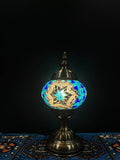 Mosaic Table Lamp showcasing vibrant blue star Turkish glass design, radiating warm light.
