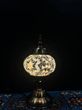 Mosaic Table Lamp with intricate glass design illuminating a beautiful glow, perfect for decor.