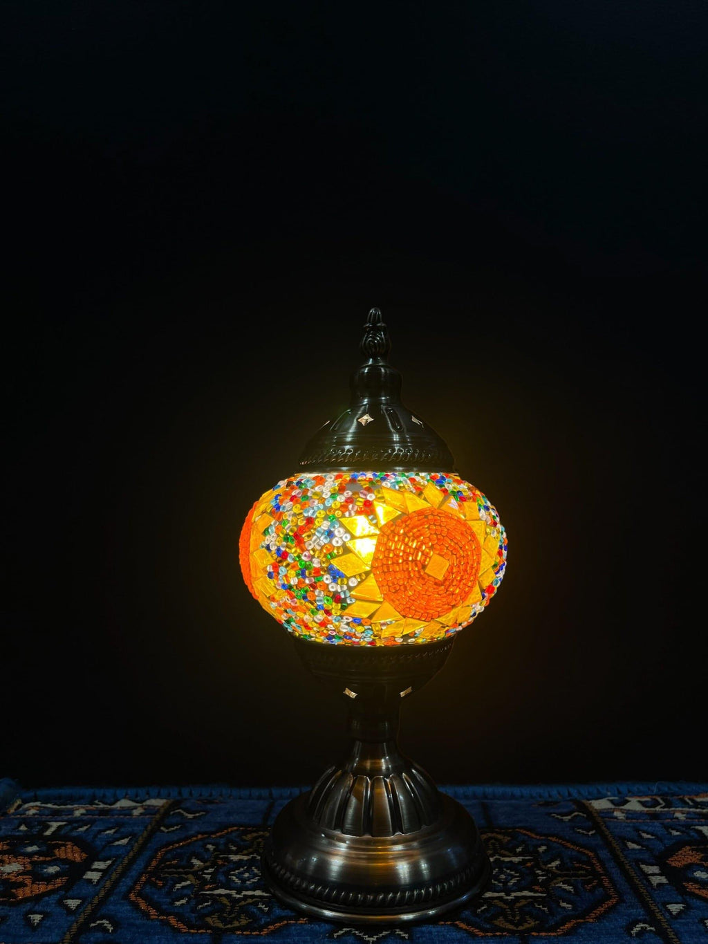 Mosaic Table Lamp with vibrant glass design featuring traditional Turkish patterns, illuminating warm colors.