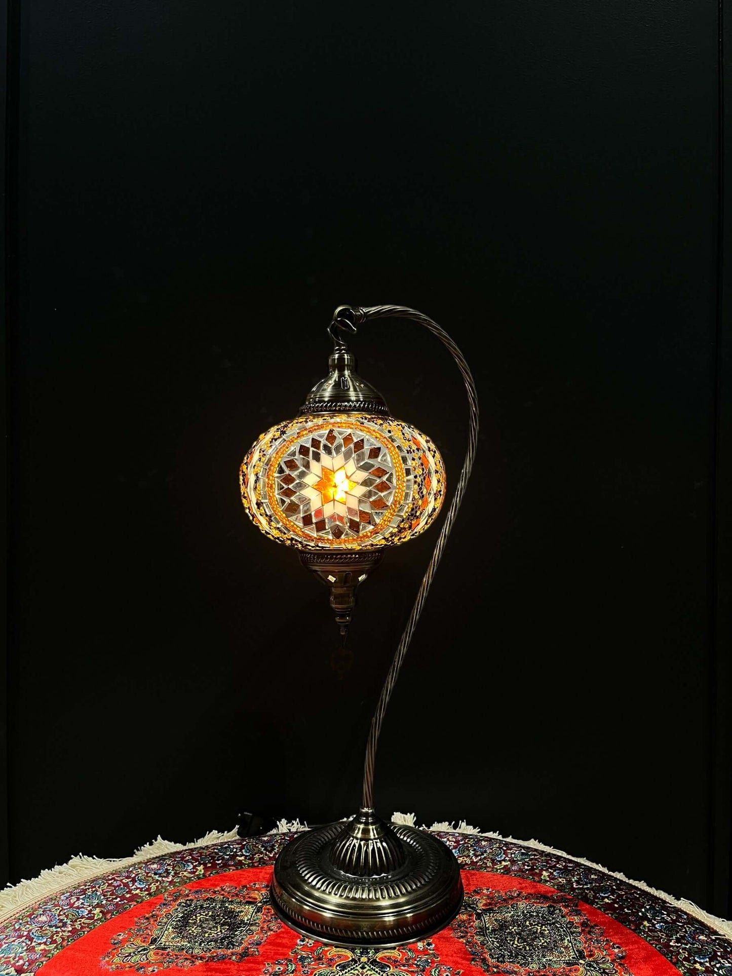 A mosaic lamp, also known as a Turkish lamps, is a decorative lighting fixture with intricate designs and colorful glass pieces.