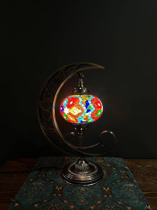Elevate your space with our Mosaic Moon Lamp, a fusion of Turkish artistry and celestial charm. Handcrafted to perfection, it captures the beauty of Turkish mosaic lamps. Add a touch of lunar elegance to any room, casting a soothing, warm glow. Experience