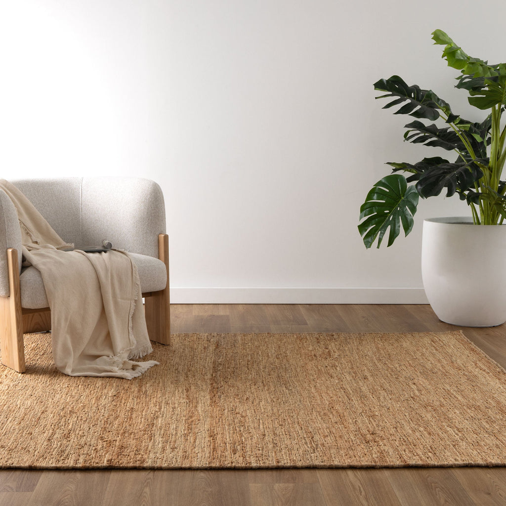 Varkala Braided Jute Rug styled with furniture