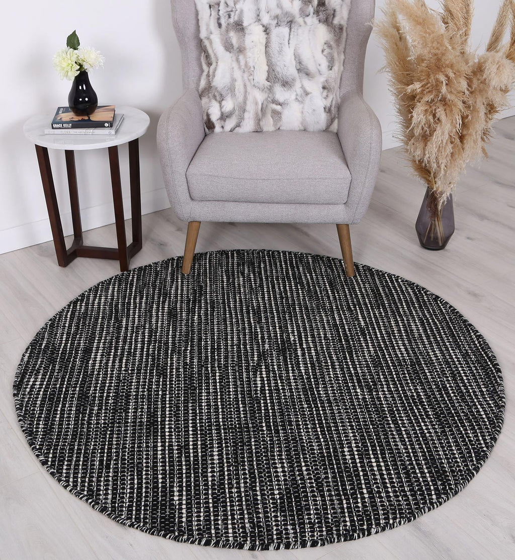 Nordic Black White Reversible Wool Round Rug styled with furniture