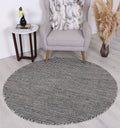Nordic Charcoal Reversible Wool Round Rug styled with furniture