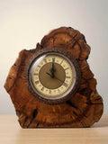 Natural Wood Table Clock 25cm with ornate brass details on a rustic wood base.