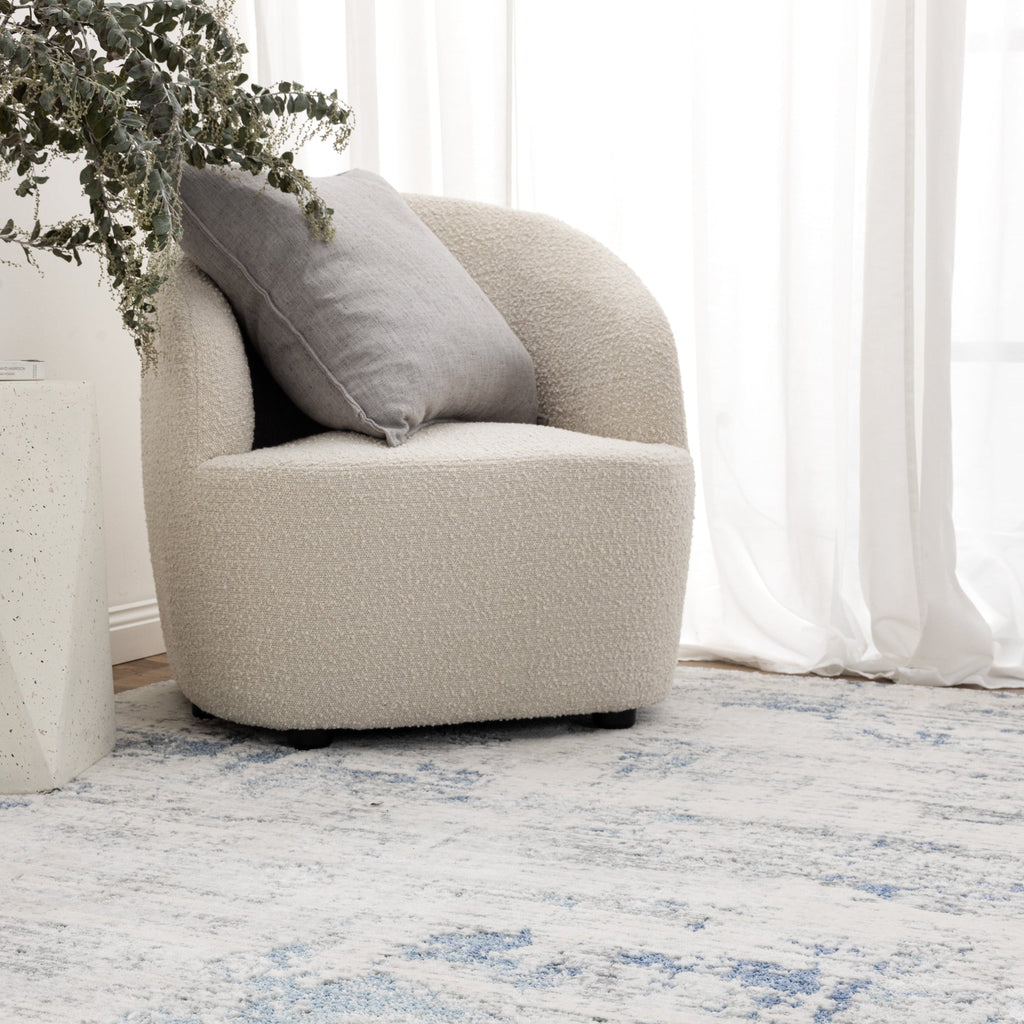 Pierre Cardin Ocean Abstract Blue Rug styled with furniture