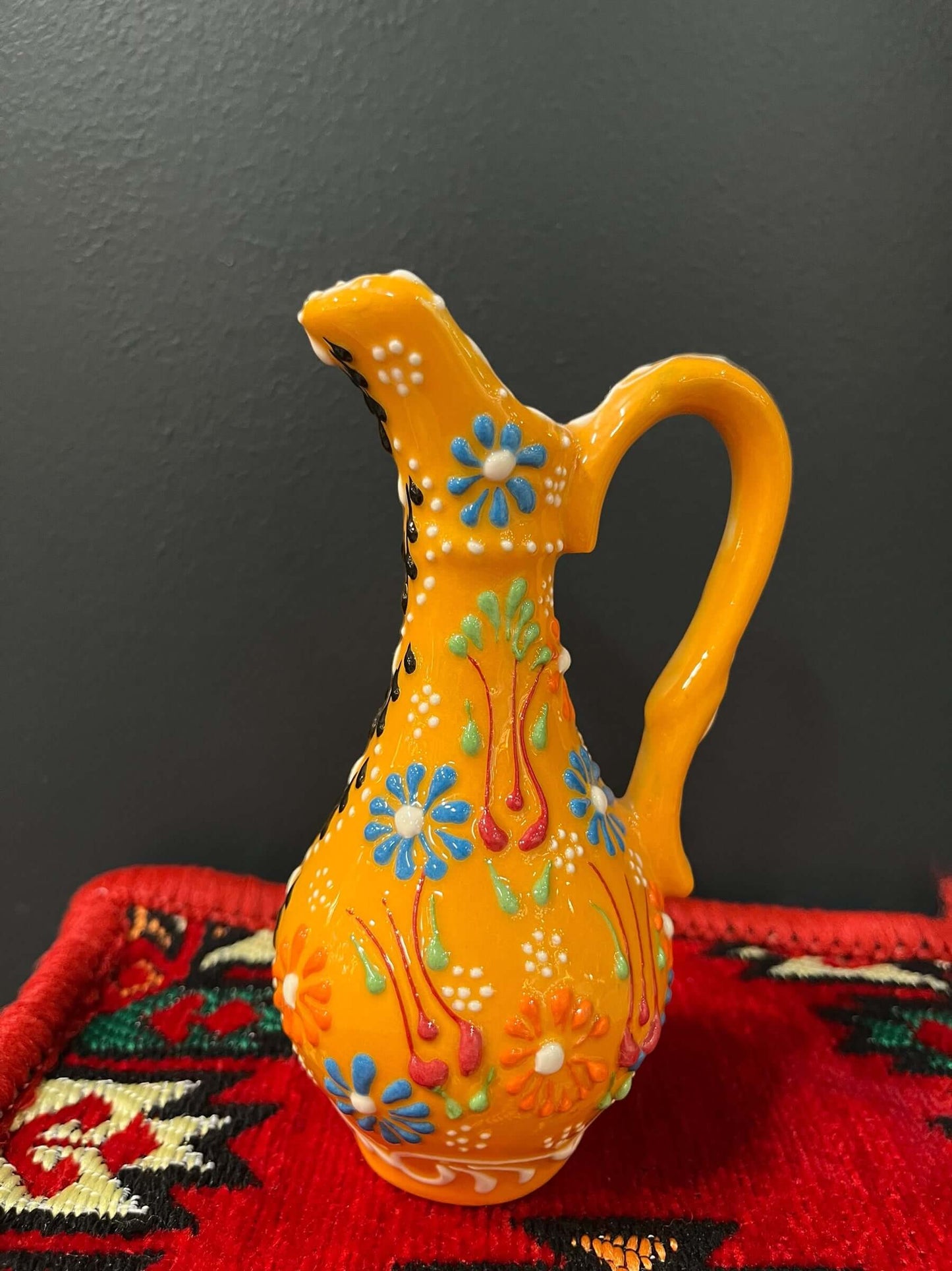 Turkish Ceramic Oil Jug adorned with captivating tulip designs, meticulously handcrafted in Turkey. Bazaar G Rugs N Gifts