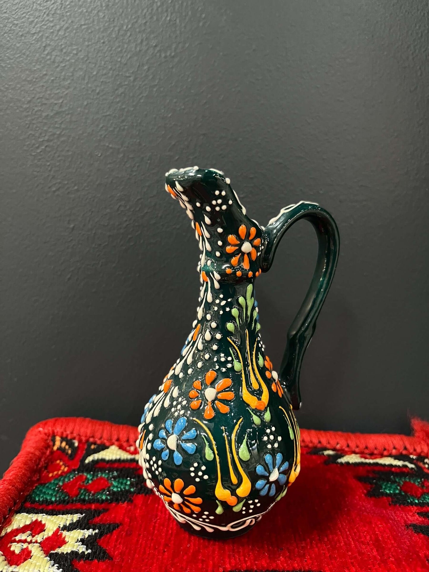 Turkish Ceramic Oil Jug adorned with captivating tulip designs, meticulously handcrafted in Turkey. Bazaar G Rugs N Gifts