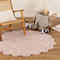Mellow Blush Pink Round Scalloped Kids Rug styled with furniture