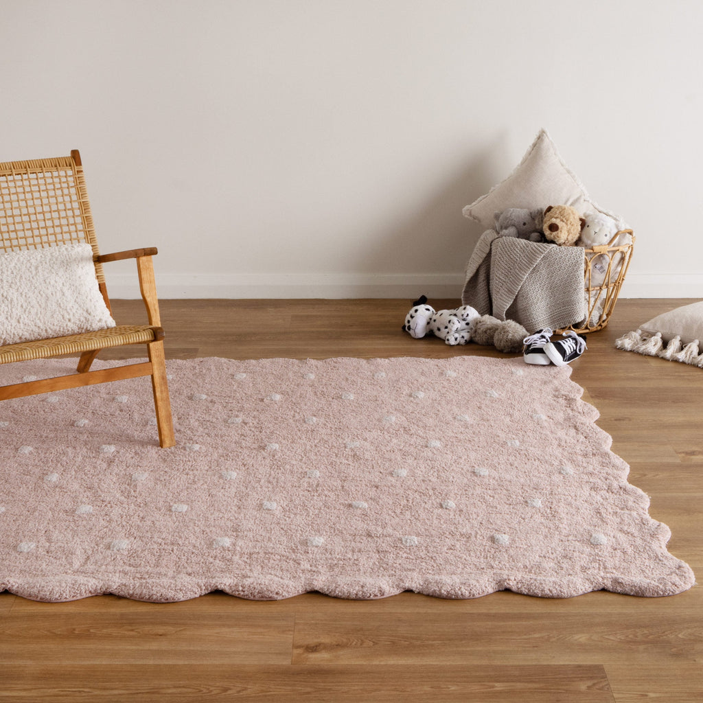 Mellow Blush Pink Rectangular Scalloped Kids Rug styled with furniture