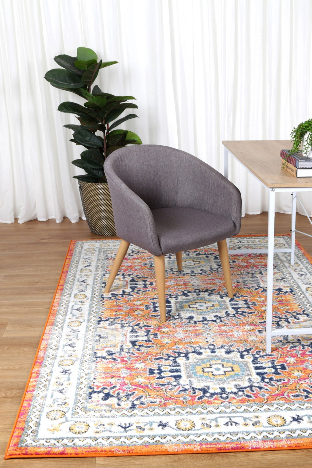 Provence Cannes Orange Transitional Rug - 020 styled with furniture