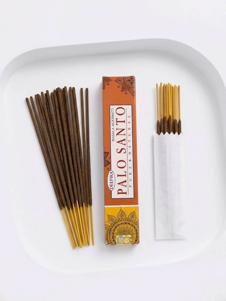 Palo Santo Incense Sticks in box with incense sticks arranged on a plate, showcasing their earthy aroma and calming qualities.