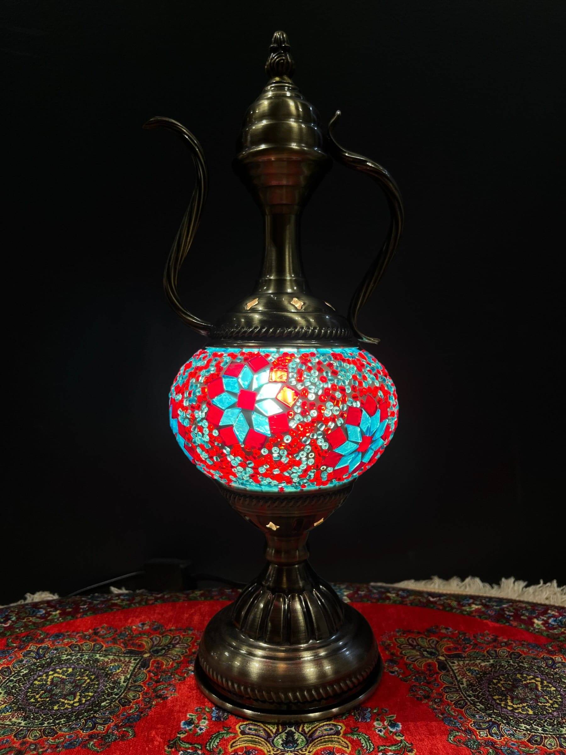 Elevate your decor with the enchanting charm of our Turkish Mosaic Genie Lamp. Handcrafted by skilled artisans, this exquisite lamp captures the spirit of the mystical East. Its intricate mosaic glass design creates a mesmerizing play of light and color,