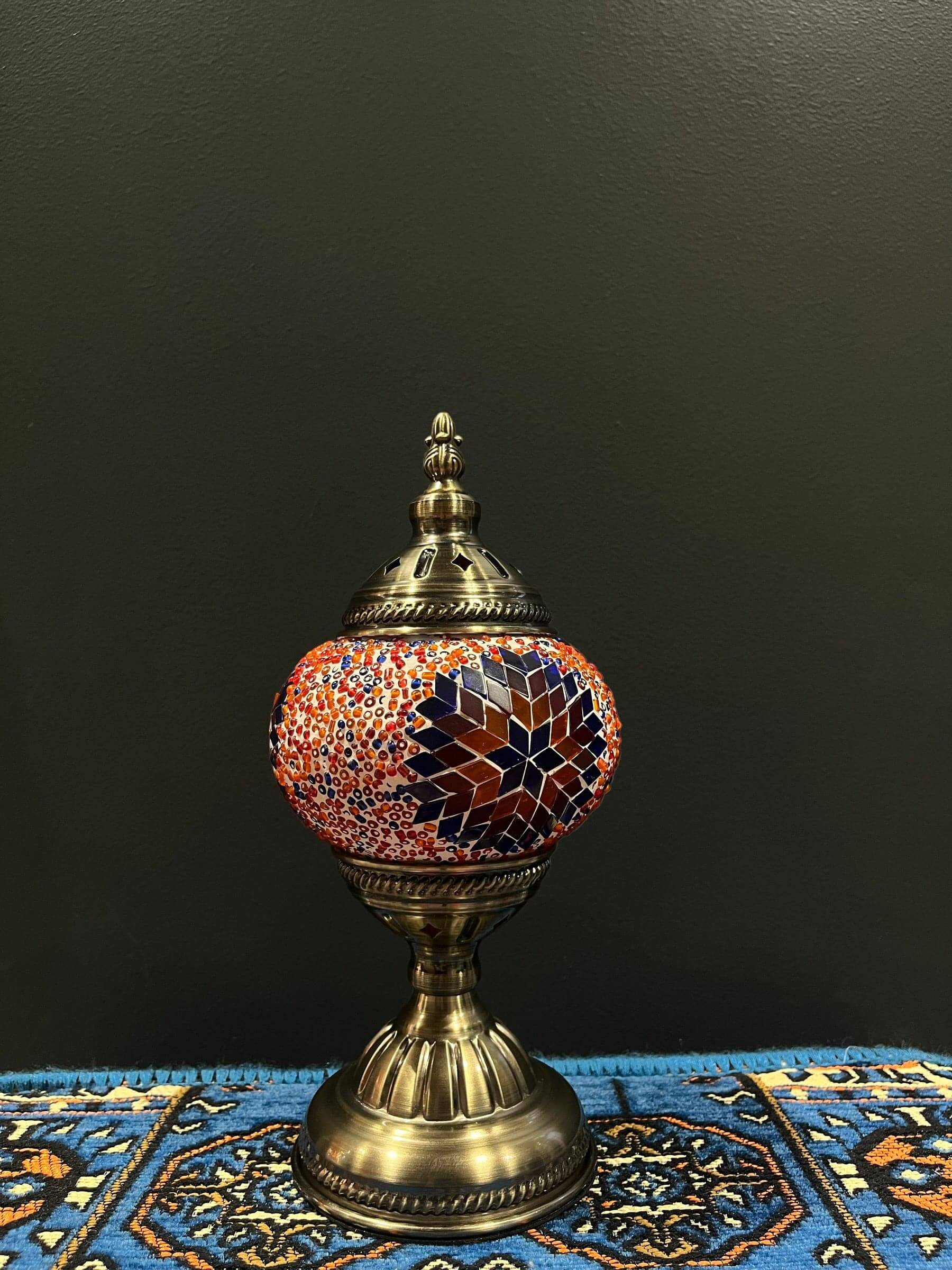 Mosaic Table Lamp Orange Blue StarMosaic Lamps: Unique and elegant decorative lighting fixtures featuring mosaic designs crafted from vibrant glass pieces. Add a touch of grace and charm to your space with these exquisite lamps, suitable for various setti