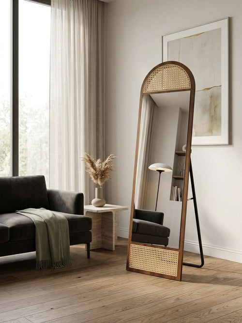 Premium Arched Wood & Rattan Floor Mirror in a stylish living room setting with natural light.