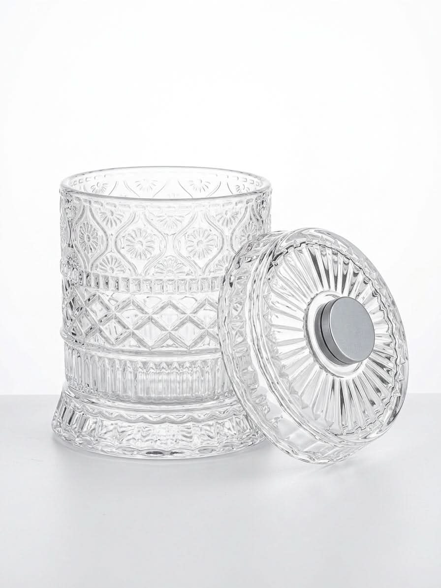 Premium rotating whiskey tumbler with elegant crystal design and lid on a white background.