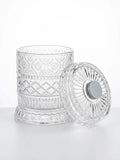 Premium rotating whiskey tumbler with elegant crystal design and lid on a white background.