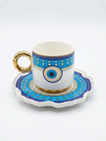Premium Turkish coffee cups with evil eye design featuring vibrant blue motifs and elegant gold details.