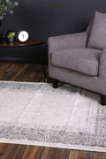 Rapsody Bach Ash Contemporary Rug - 01CREA styled with furniture