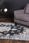 Rapsody Bizet Navy Transitional Rug - 02NAVY styled with furniture