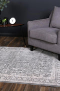 Rapsody Liszt Grey Transitional Rug - 08GREY styled with furniture