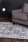 Rapsody Rossini Navy Traditional Rug - 09NAVY styled with furniture