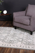 Rapsody Rossini Grey Traditional Rug - 10GREY styled with furniture