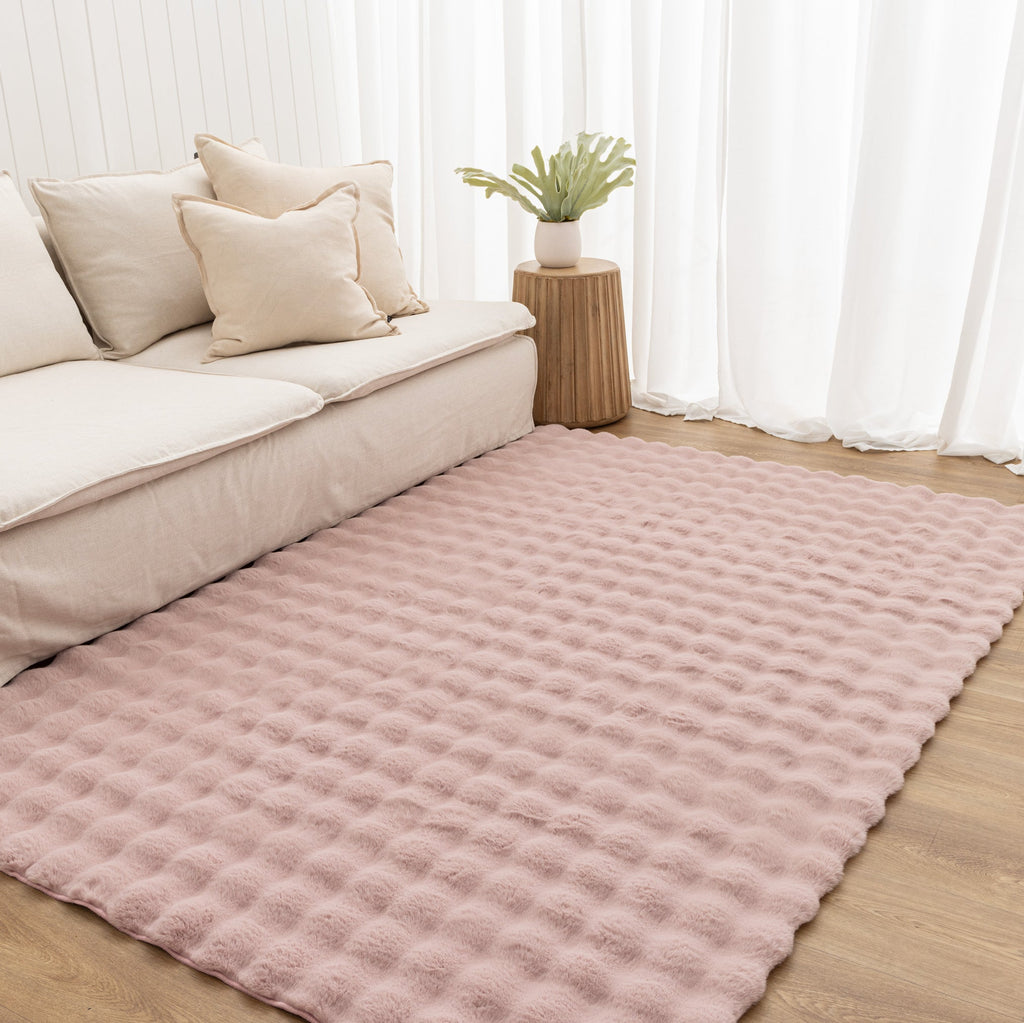 Purity Washable Rug Rose Pink styled with furniture