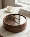 Rotating Serving Tray with Glass Lid – 360° Wooden Storage Tray on a table with a cup and books.