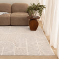 Solenne S902 Neutral Arches Rug styled with furniture