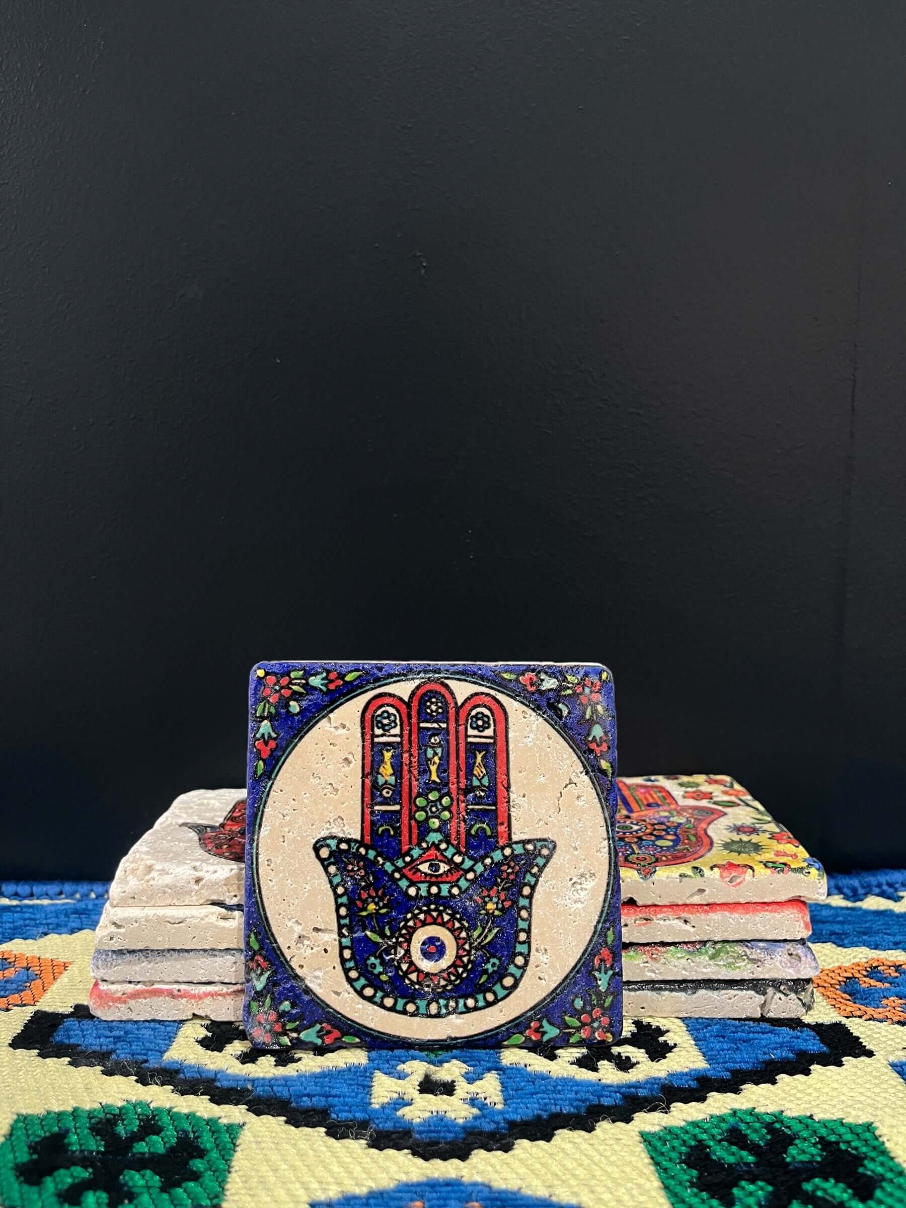 Stone Coaster Hamsa Hand Blue&White-a captivating blend of ancient charm and artistic elegance. Crafted from genuine vintage stone, this coaster features the intricate Hamsa hand symbol, adding a touch of timeless mystique to your space. Sealed for durabi