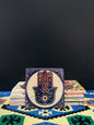 Stone Coaster Hamsa Hand Blue&White-a captivating blend of ancient charm and artistic elegance. Crafted from genuine vintage stone, this coaster features the intricate Hamsa hand symbol, adding a touch of timeless mystique to your space. Sealed for durabi