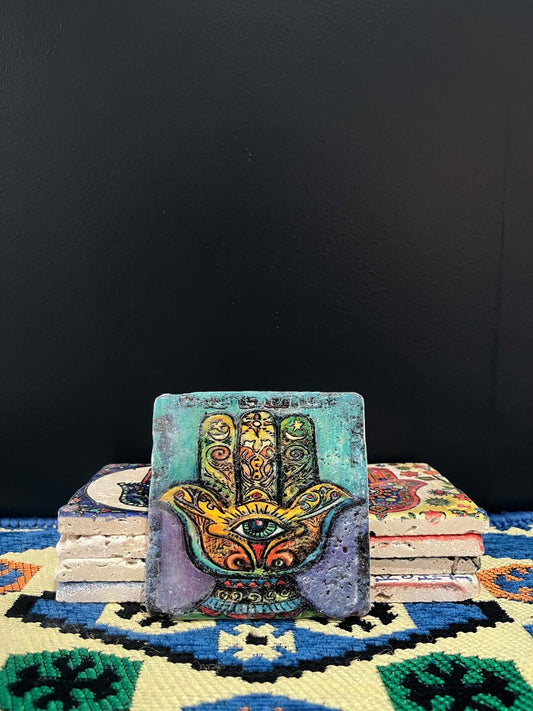 Stone Coaster Hamsa Hand Green-a captivating blend of ancient charm and artistic elegance. Crafted from genuine vintage stone, this coaster features the intricate Hamsa hand symbol, adding a touch of timeless mystique to your space. Sealed for durability,
