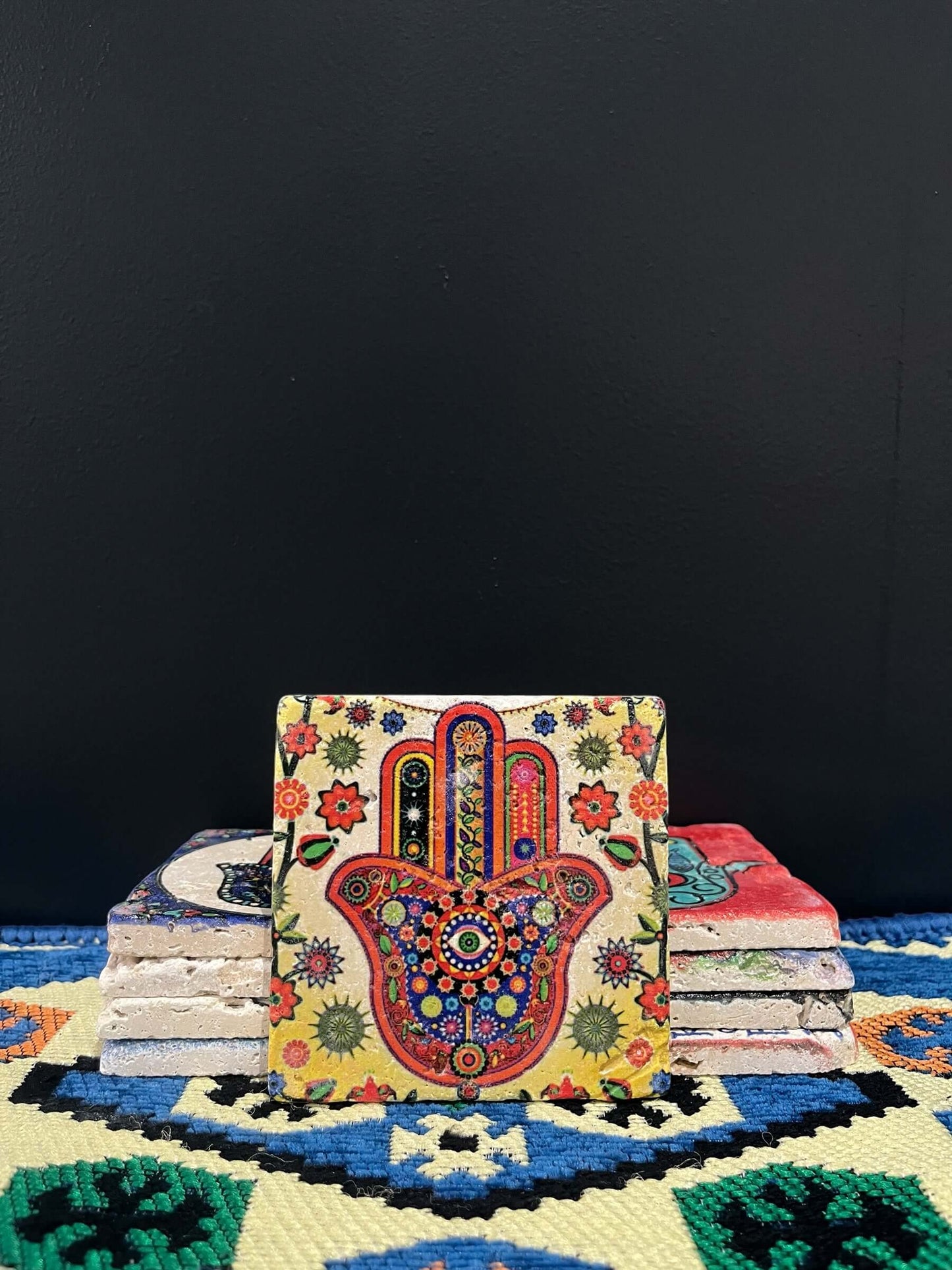 Stone Coaster Hamsa Hand Rainbow-a captivating blend of ancient charm and artistic elegance. Crafted from genuine vintage stone, this coaster features the intricate Hamsa hand symbol, adding a touch of timeless mystique to your space. Sealed for durabilit