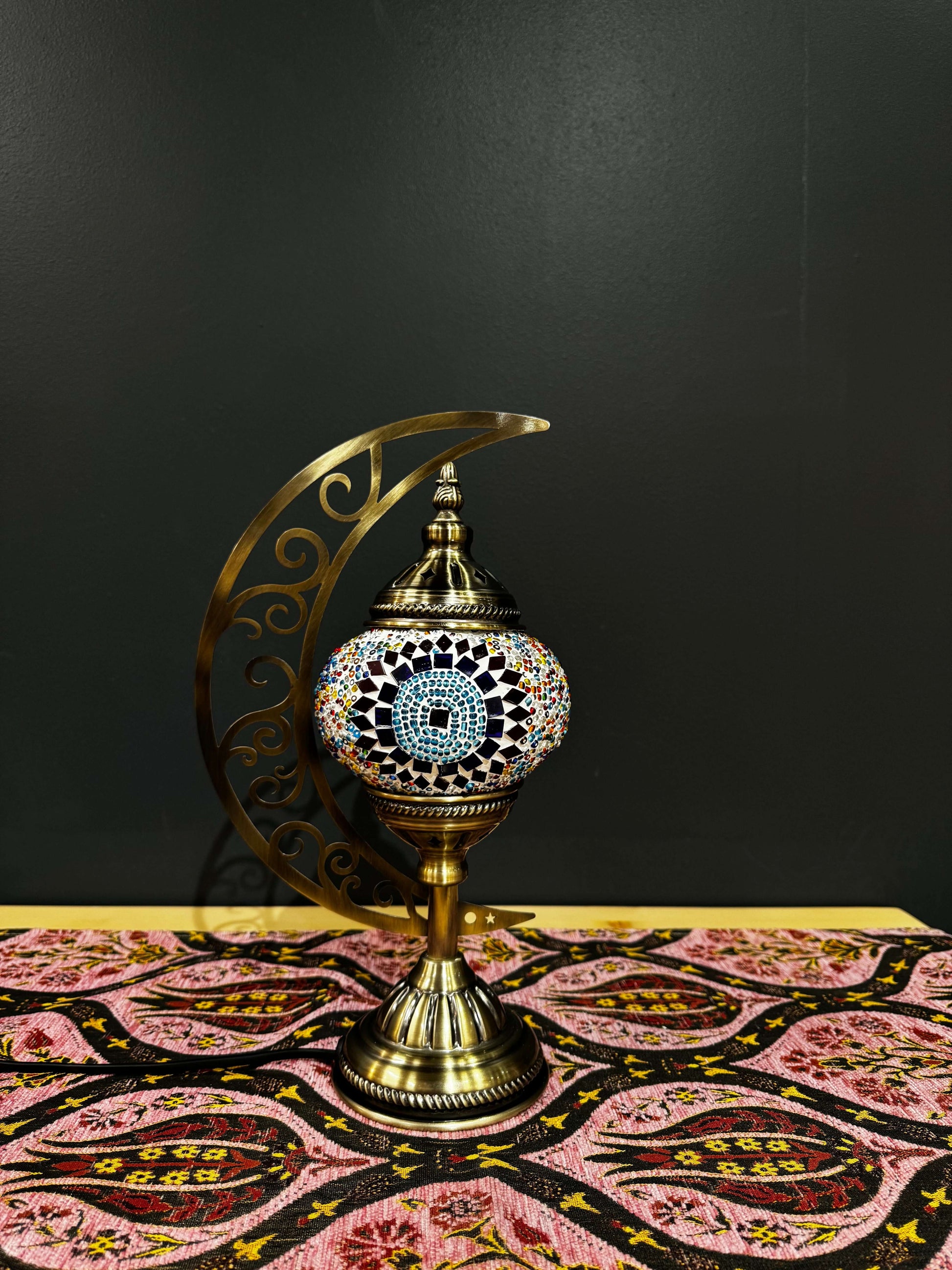 Sunburst Circle Turkish Mosaic Lamp - Crescent Moon Design-Shop the Sunburst Circle Turkish Mosaic Lamp! Features vibrant red, blue, and multicolored circular mosaic design with a crescent moon stand. Includes LED bulb. Perfect for decor or gifting.-Bazaa