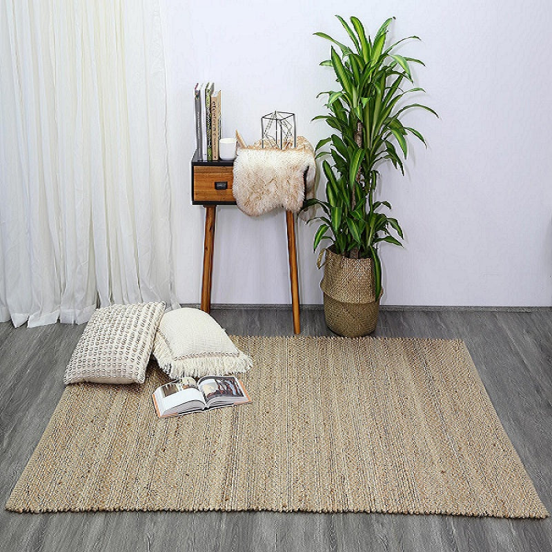 Taj Natural Basket Weave Black Jute Rug styled with furniture