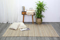 Taj Grey Natural Basket Weave Jute Rug styled with furniture